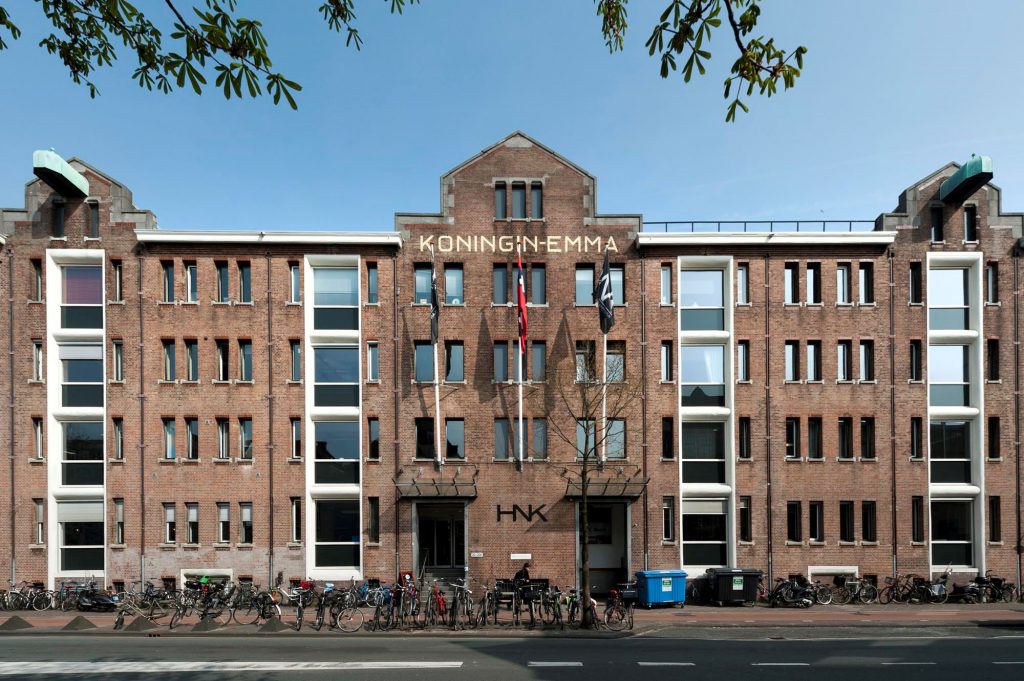 a large brick building with lots of windows.