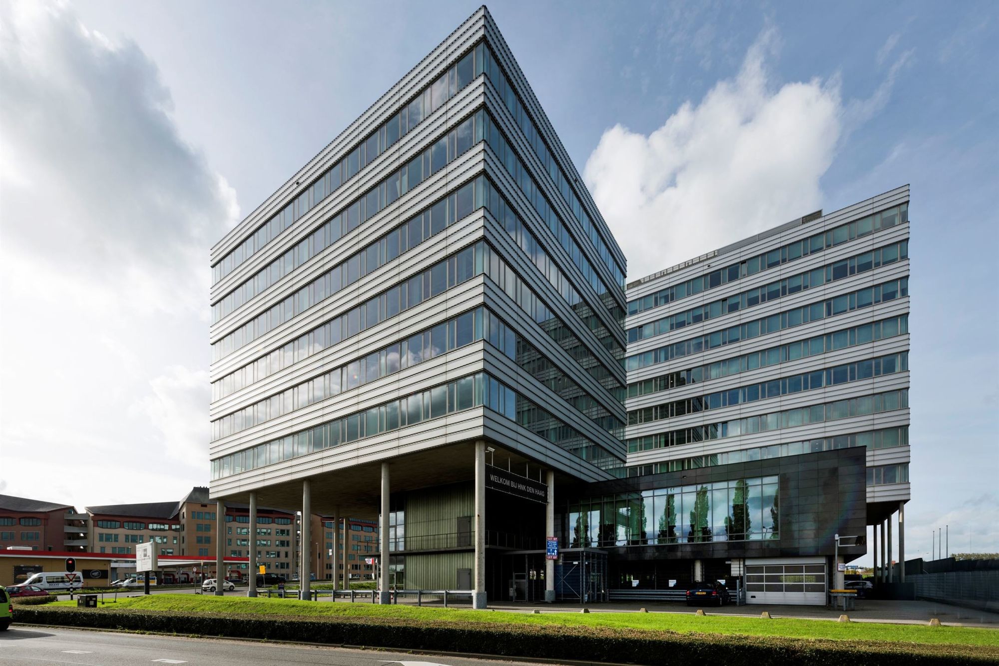 a large office building sitting on the side of a road.